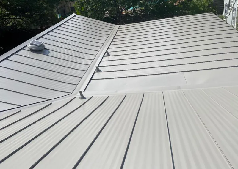 Solar attic fan installed on a metal roof for Roof Ventilation in Madeira